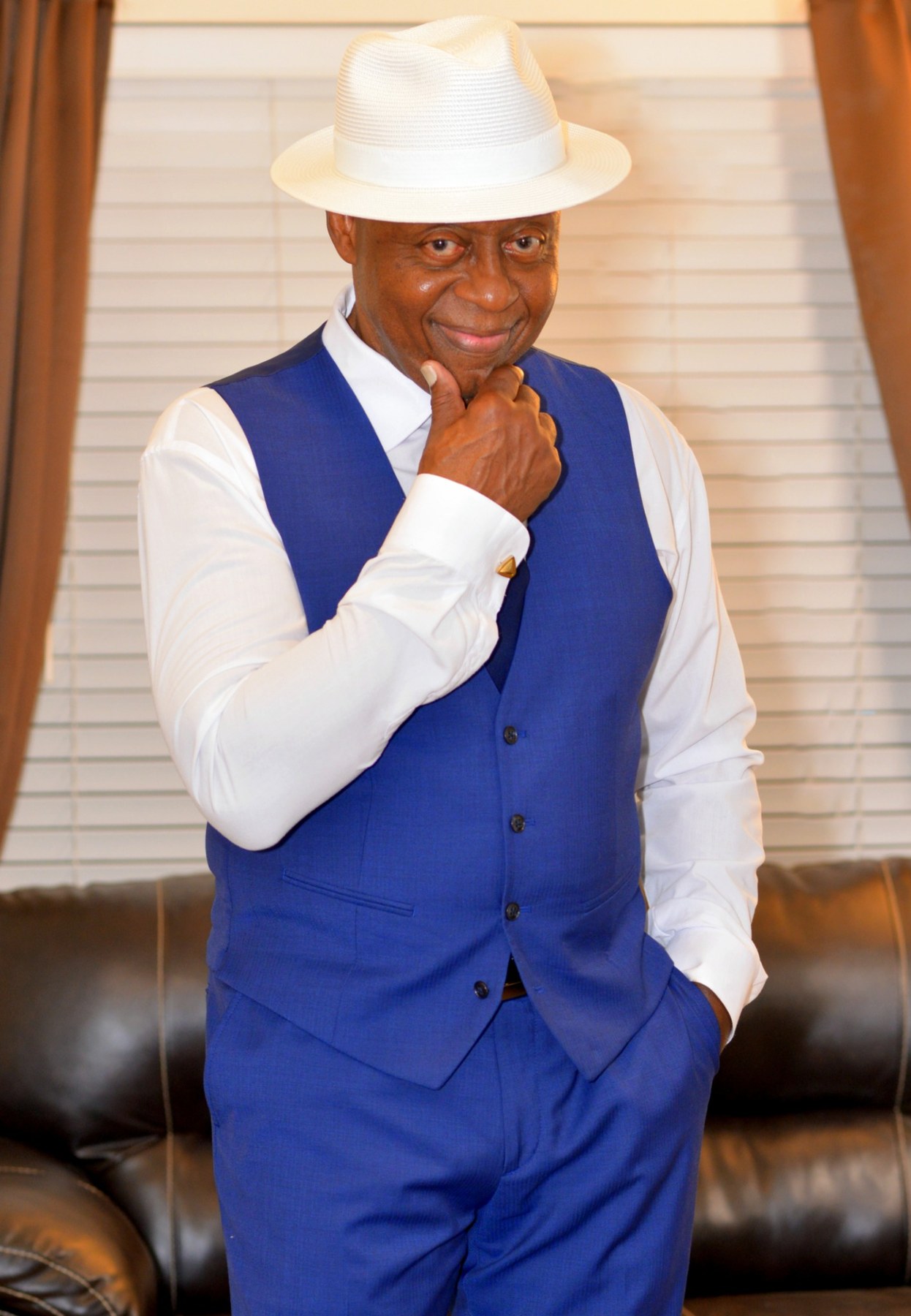 Blue waistcoat outfit portrait with white fedora